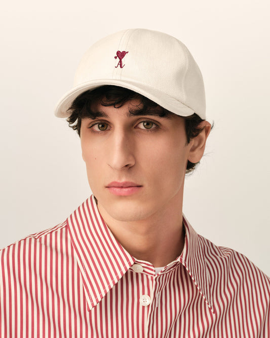 White cotton cap with Ami de Coeur arrow